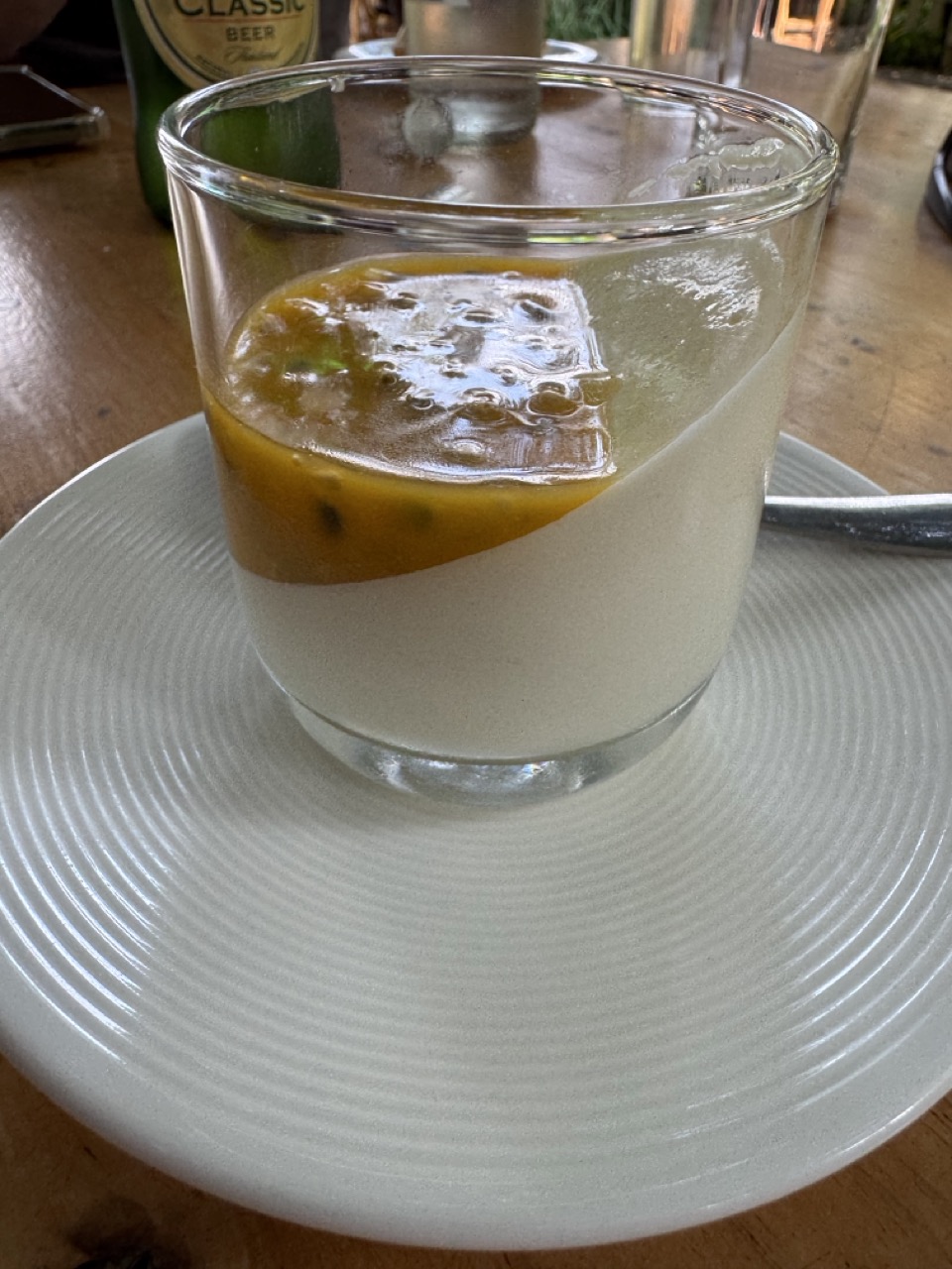 Passionfruit panna cotta — not what we ordered first, not a flavour I’d pick in a Chiang Mai café, but at the end of a dirt road it tasted correct.