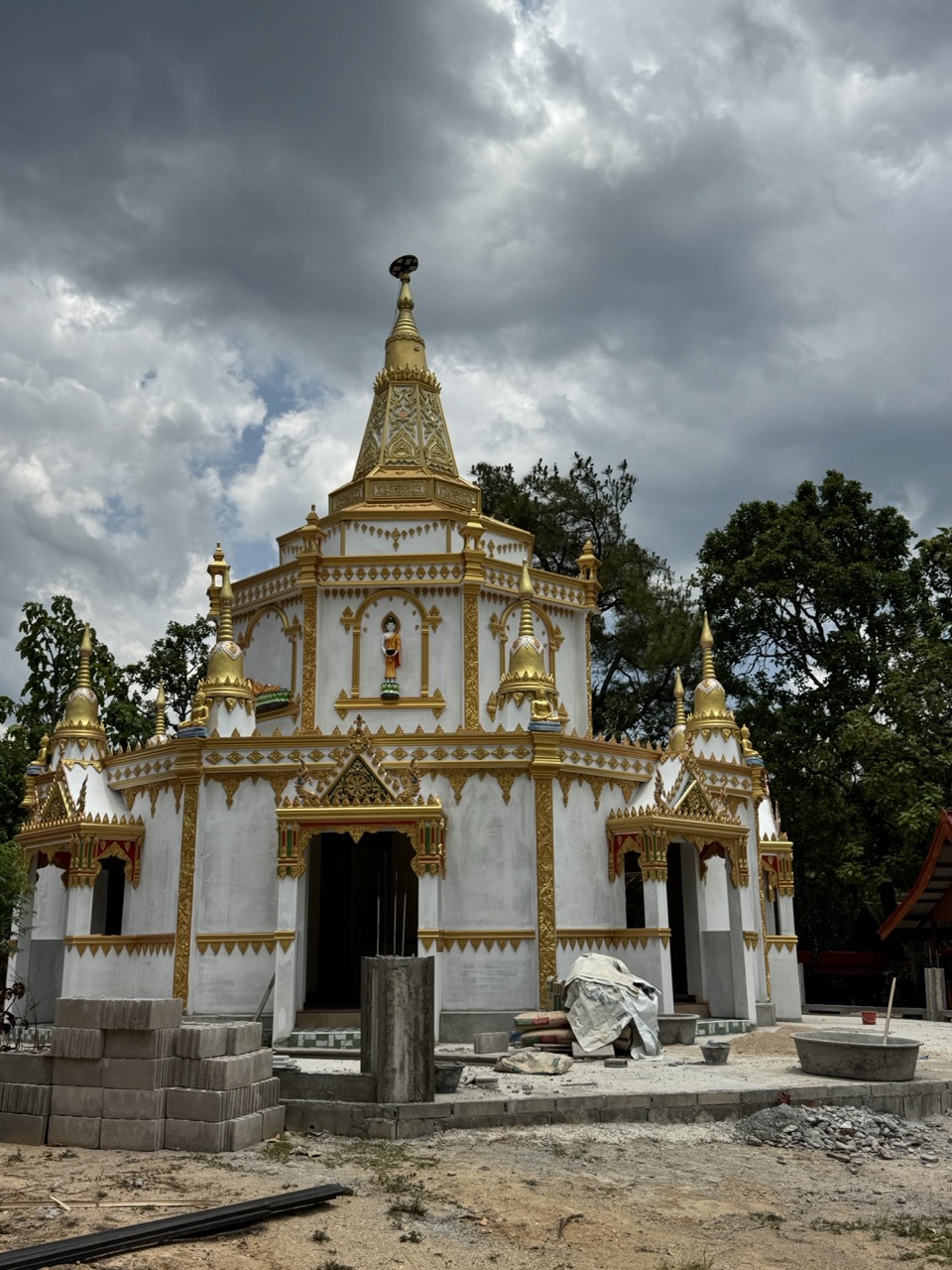 White-and-gold temple under construction in Hot — a brief stop on the way south.