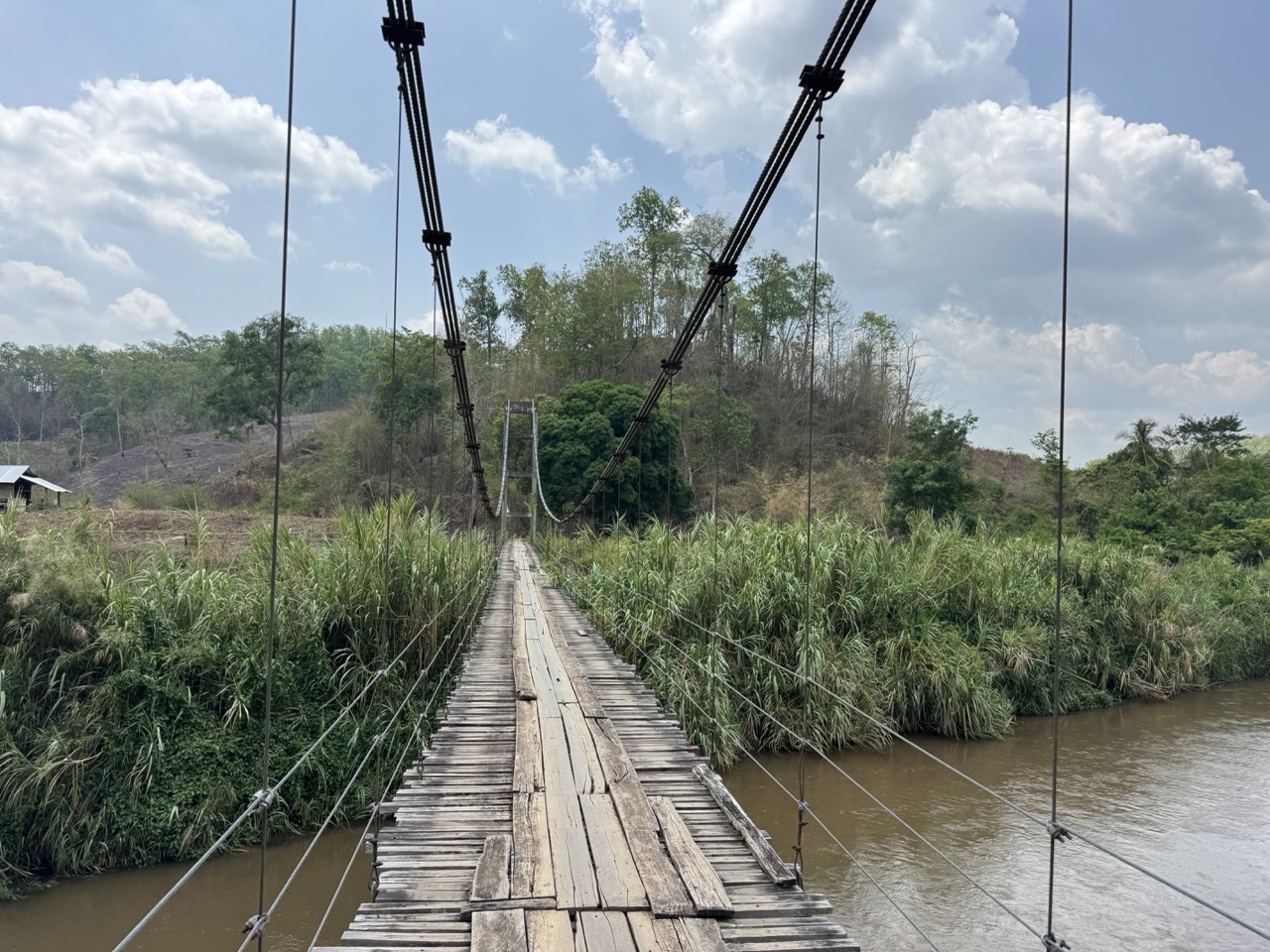 Wooden deck of the suspension bridge. Cross slow, single file.