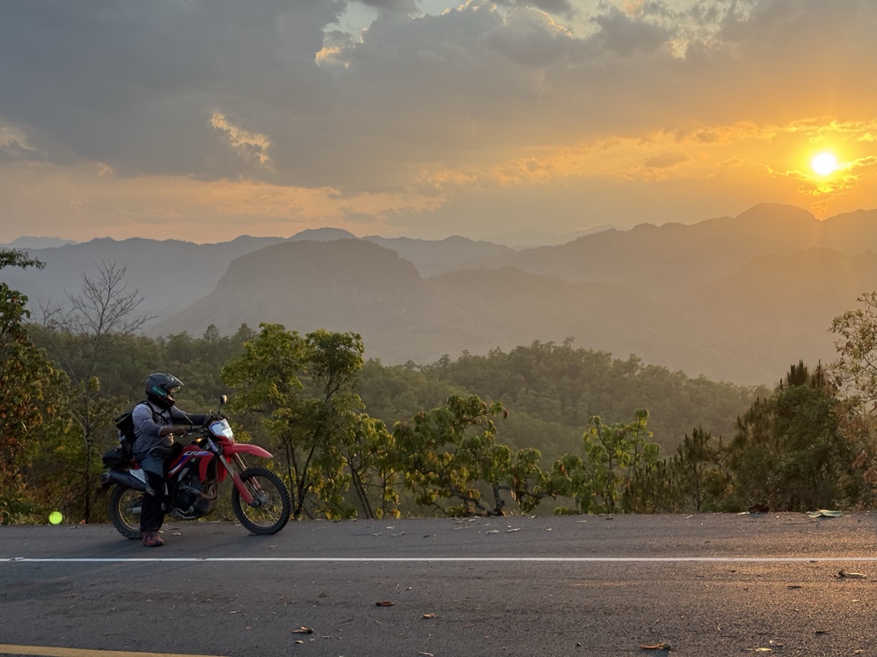 Sunset stop above Pang Mapha. Five minutes of standing around, then back on the bikes.