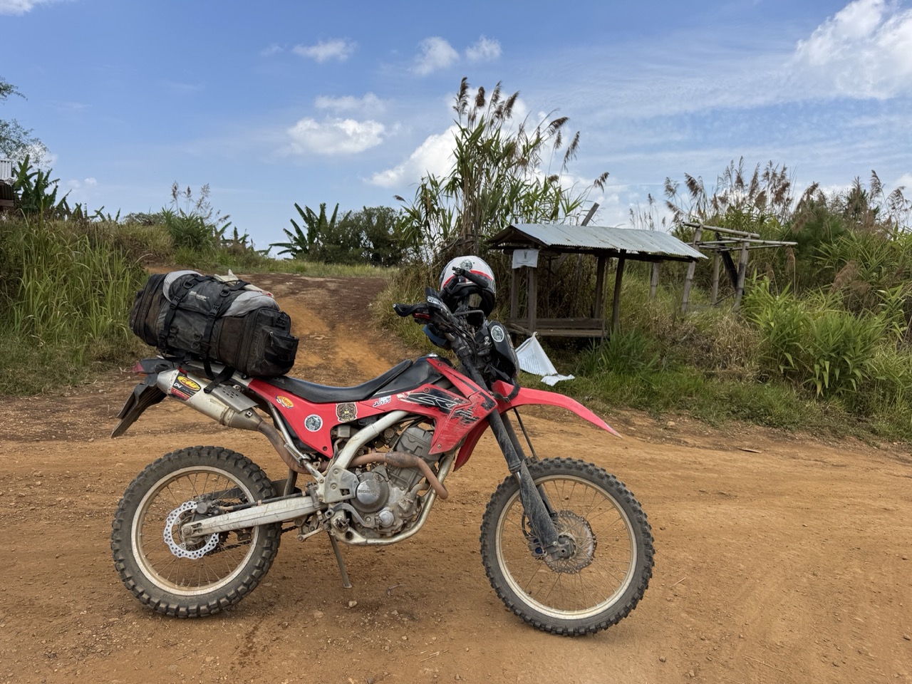 A loaded CRF parked at a bamboo trail shelter in the park.