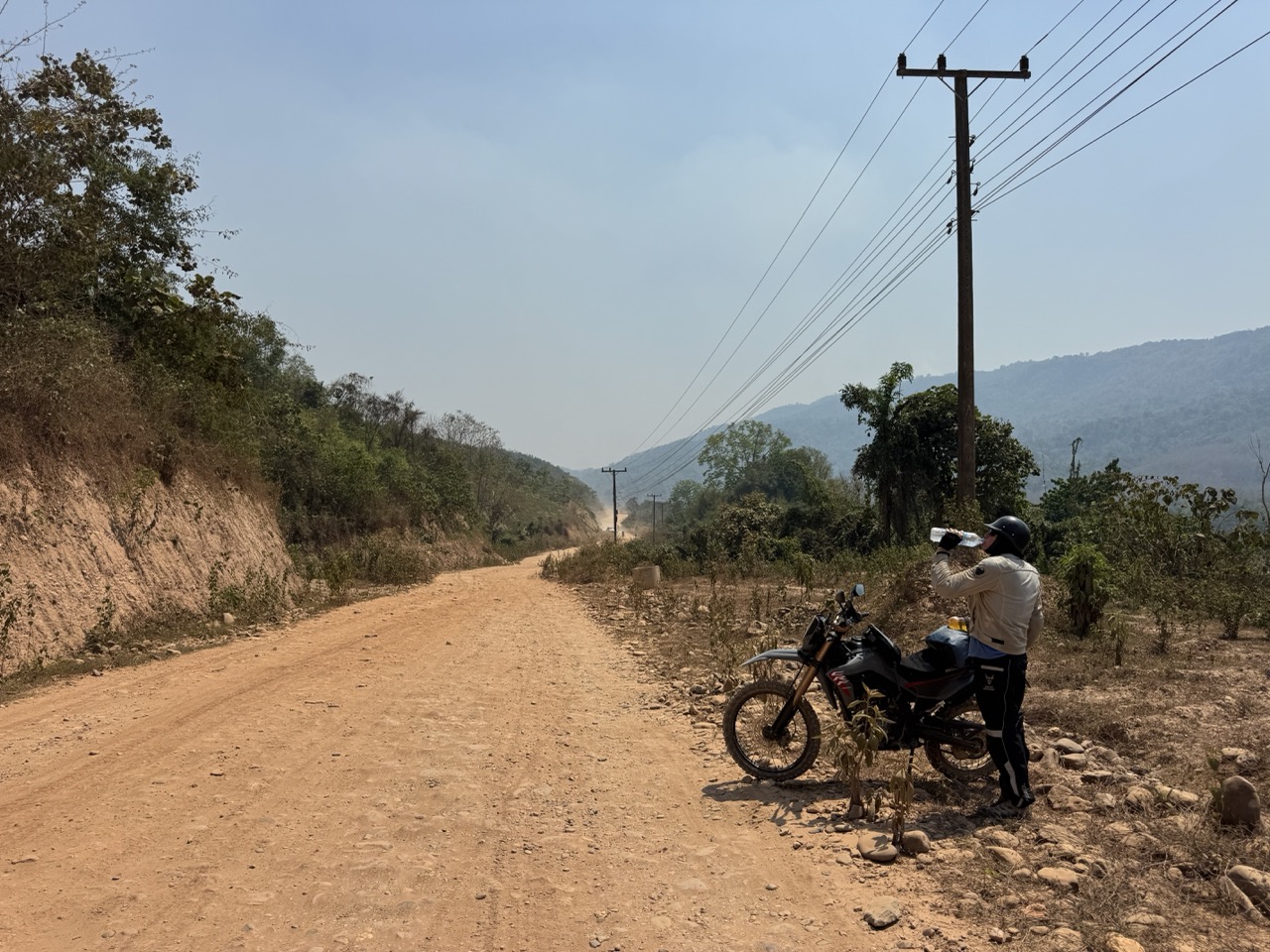 A water stop on a dusty mountain road. You drink water on the hour, every hour, in April.