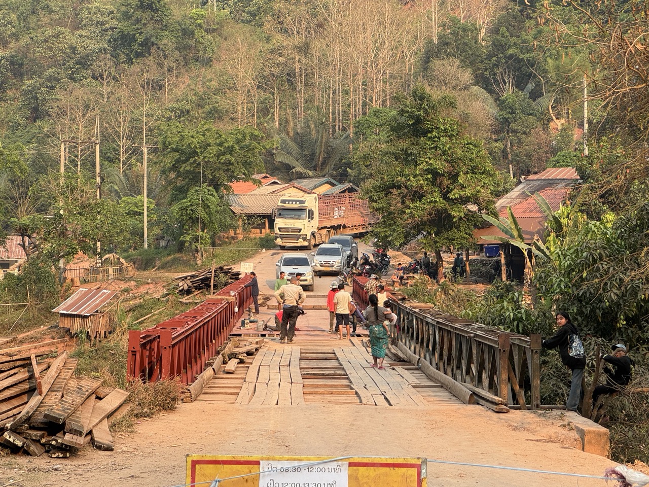 Wooden truss bridge — wait your turn for the truck. Half the bridges in northern Laos are still single-lane affairs.