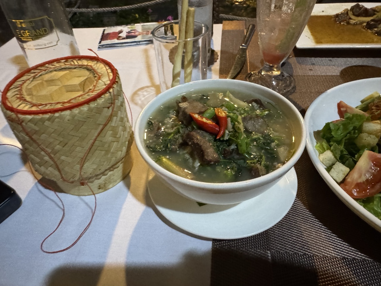 Lao soup and sticky rice at the resort restaurant. The first proper Lao meal of the trip.