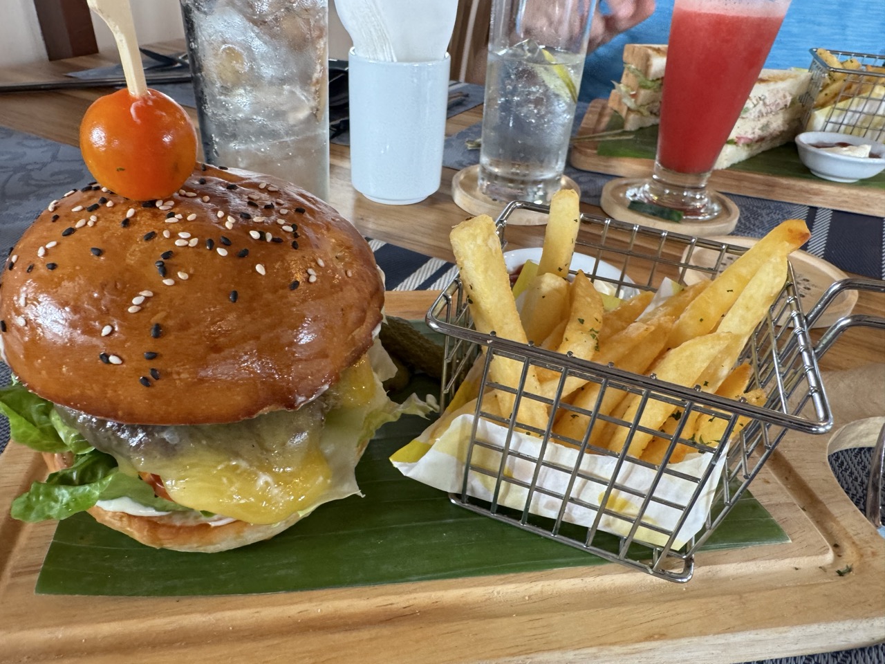 Burger and fries lunch by the Mekong. Day-3 calorie damage.