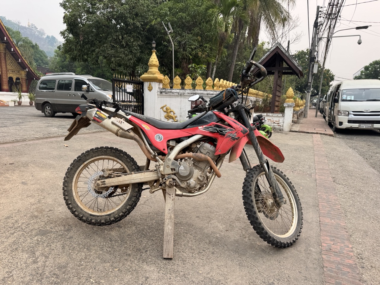 CRF parked at a wat gate in the late afternoon, before the festival crowd really got going.