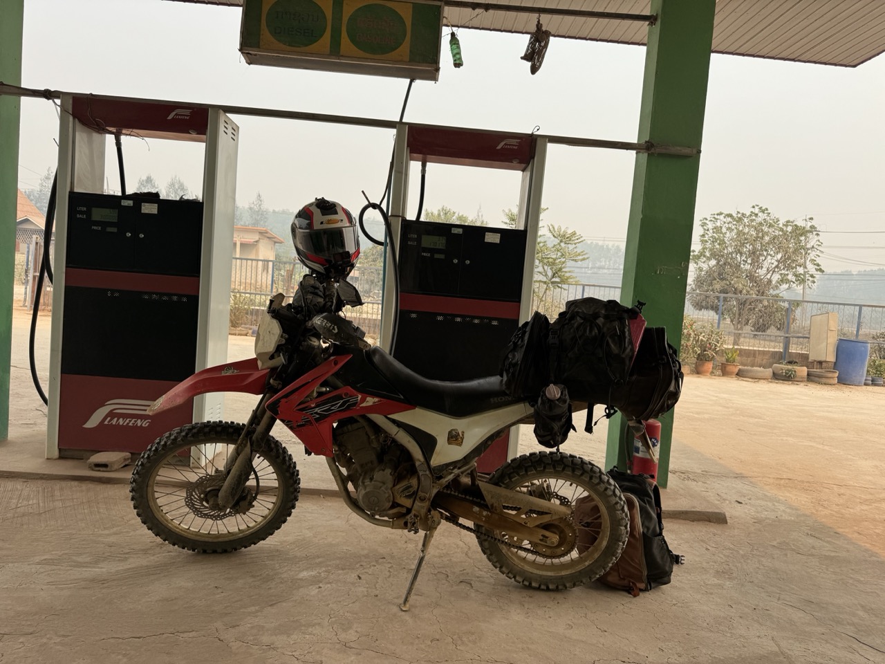 A Lan Feng gas station fuel stop in Oudomxay. The Chinese chains have largely replaced the old hand-pump operations on the main highway.