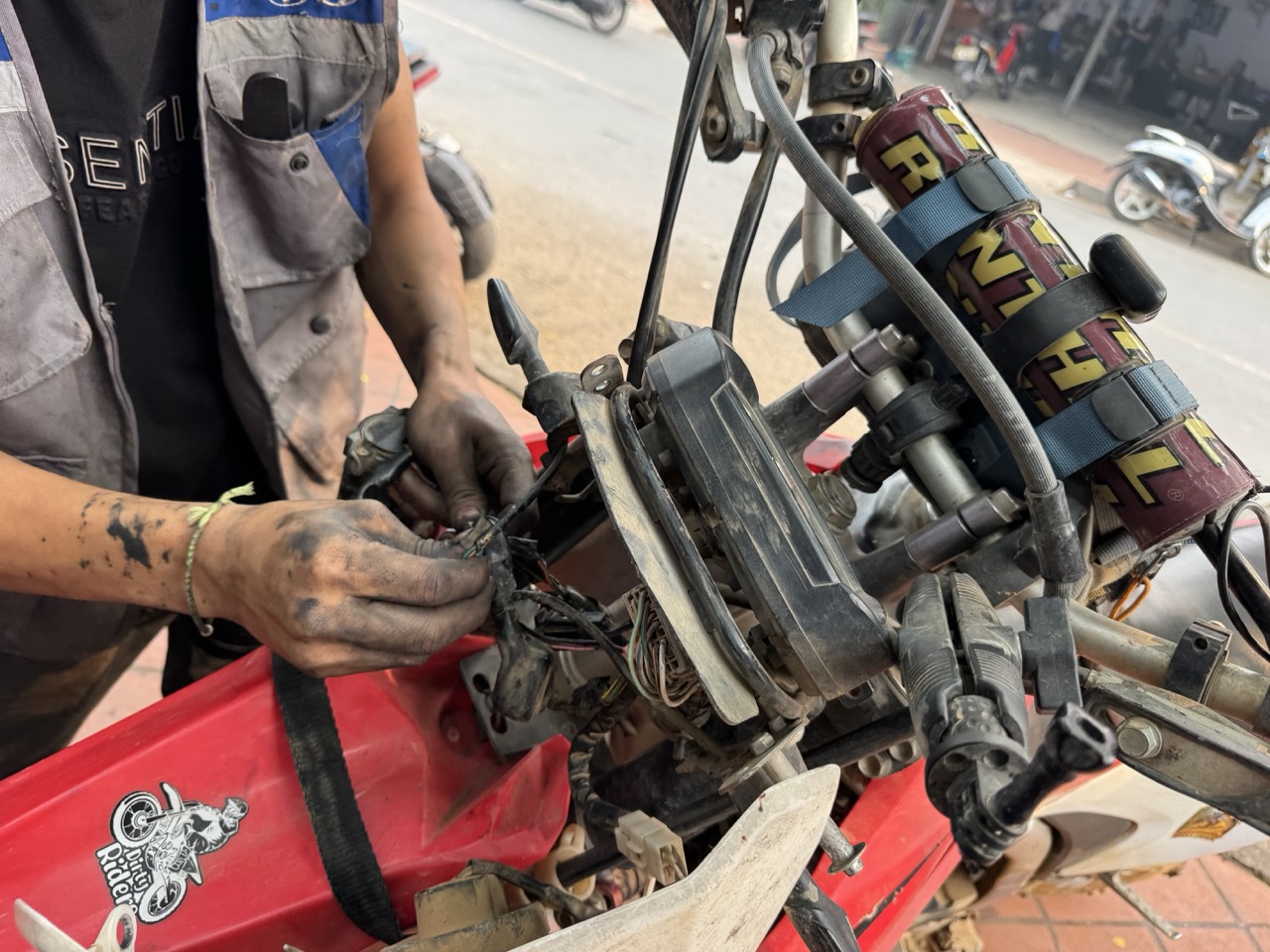 Hands re-pinning the dashboard connector.