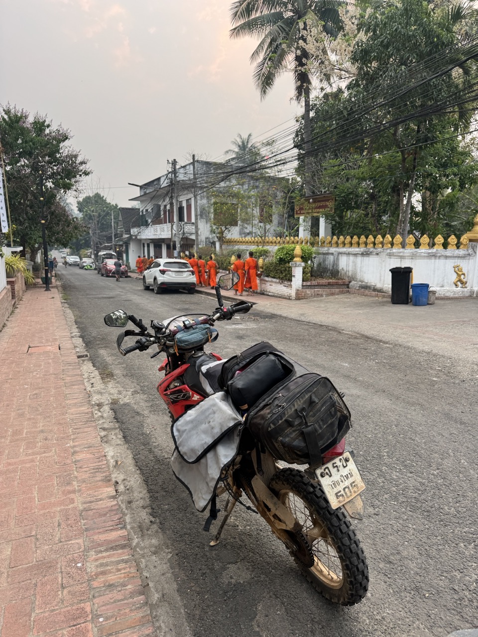 Loaded up at dawn near the alms procession. Both bikes back together and ready.