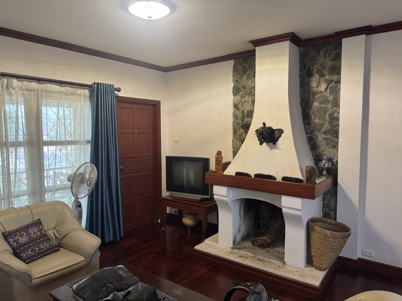 Vansana Plain of Jars hotel — stone-fireplace lounge that earns its keep on cool evenings.
