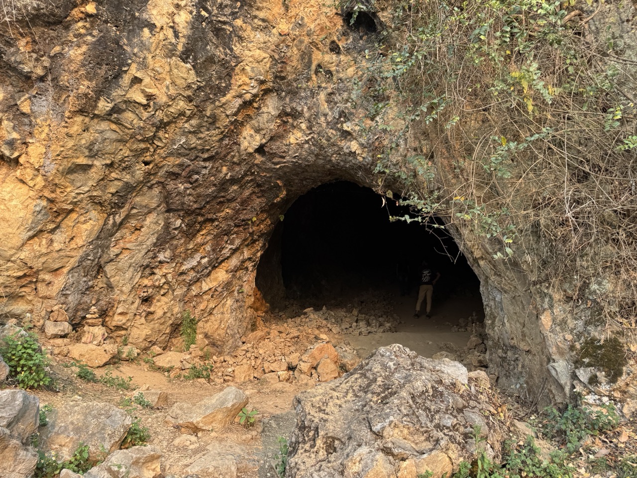 Vietnam War cave opening at the edge of the site — used as a shelter during the bombing.