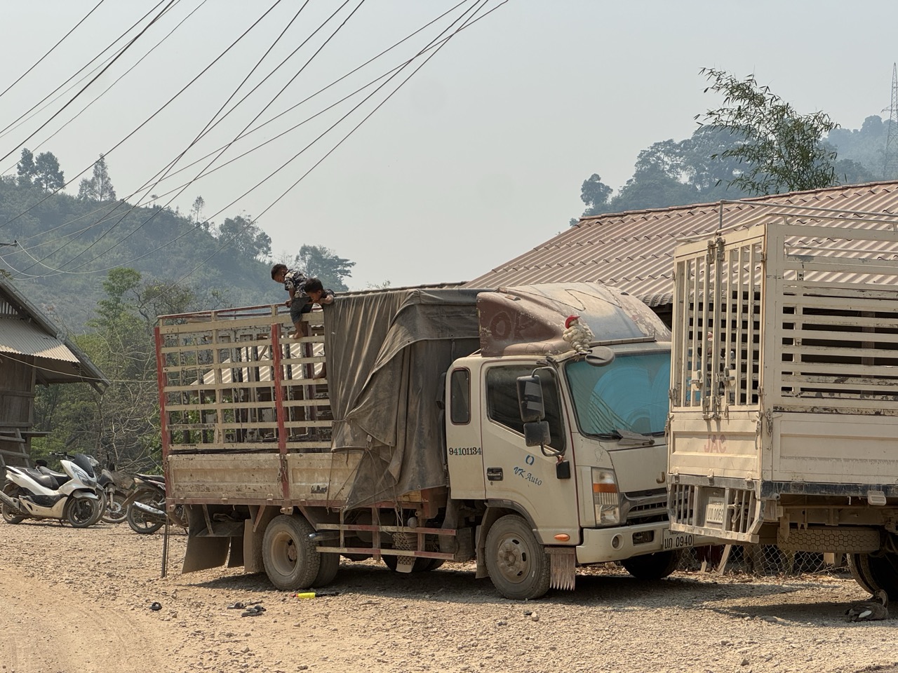 Lao cargo truck loading area at one of the bigger road junctions.