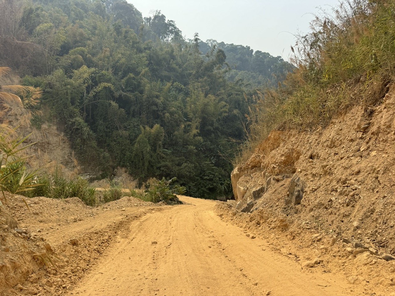 A narrow cut through a hillside. You give every blind corner a horn tap.