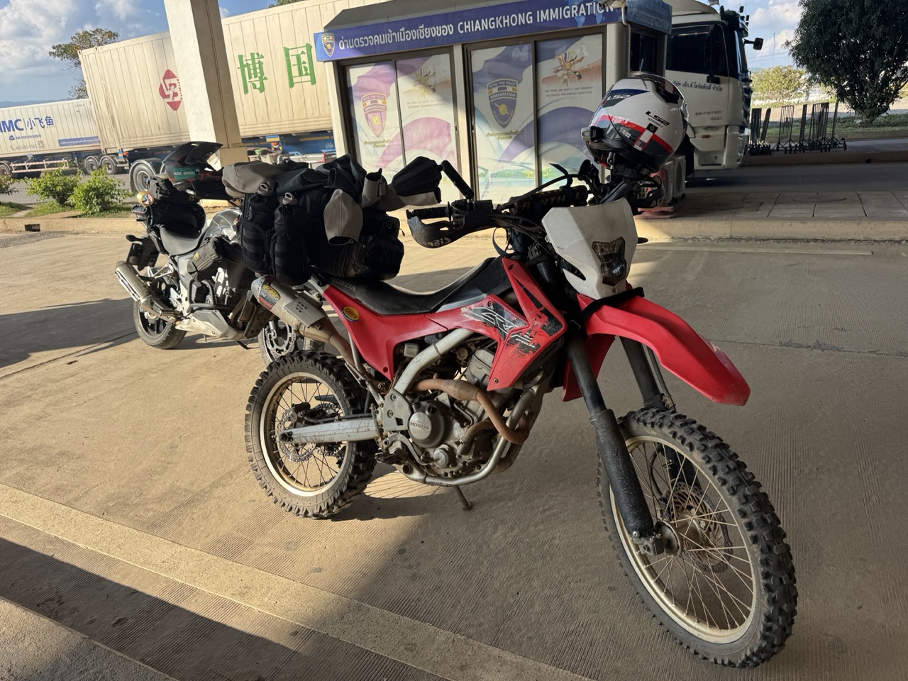 Bikes lined up at Chiangkhong Immigration. The temporary import paperwork was routine — no drama.