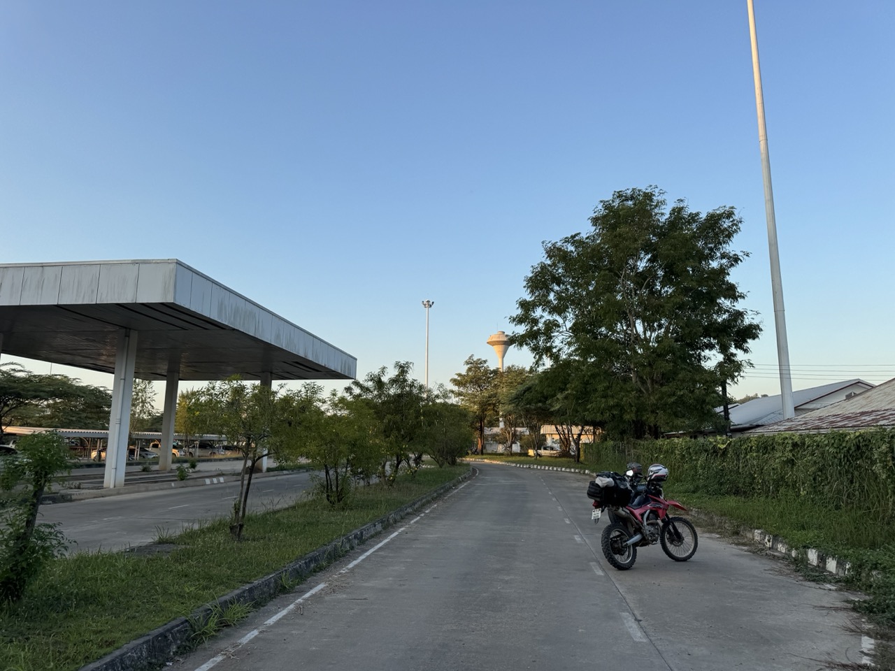 First evening in Laos — a quiet road on the way to the hotel, water tower in the distance.