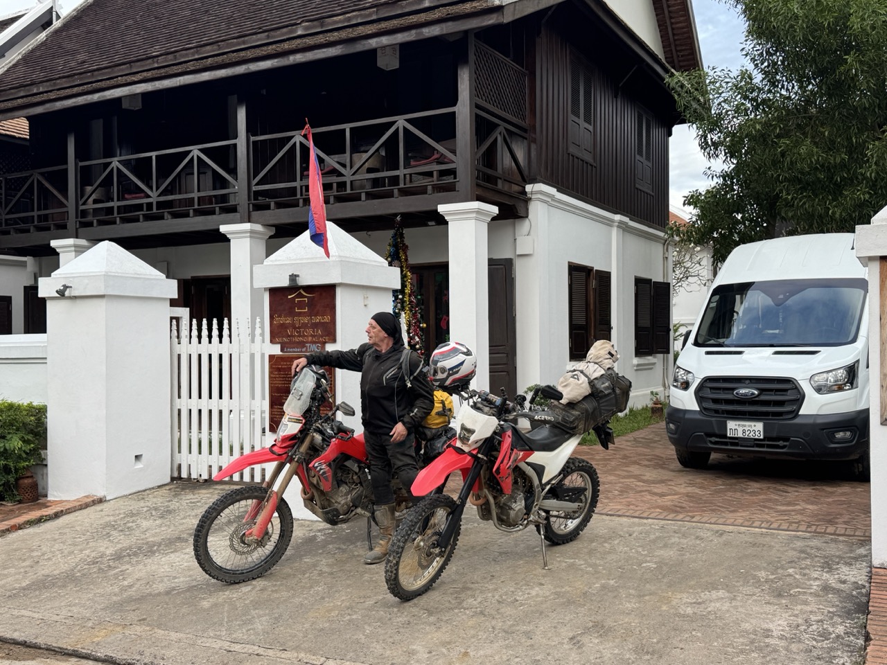 Loaded up outside Victoria Xiengthong Palace at dawn — three nights had become a comfort that was about to end.